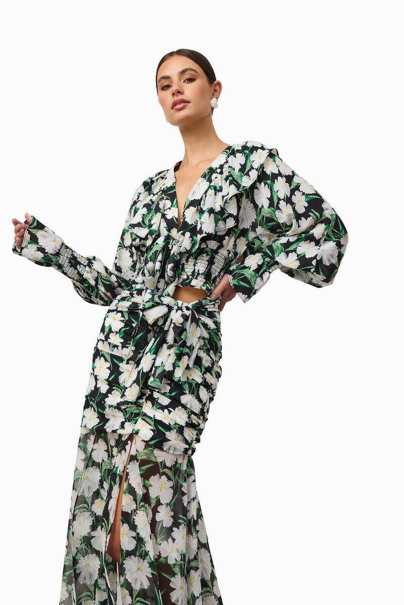 Brunette model wearing Rosey Long Sleeve Set in Black Floral close up hand on hip shot