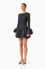 Brunette model wearing the Theodora Long Sleeve Mini Dress in Black side shot