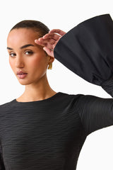 Brunette model wearing the Theodora Long Sleeve Mini Dress close up detail shot