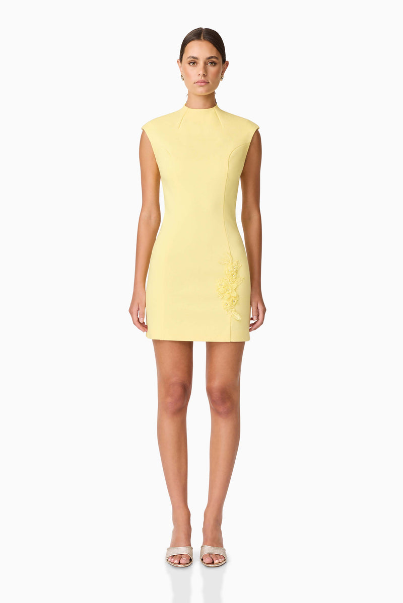 Brunette model wearing Evee High Neck Mini Dress in Yellow front shot