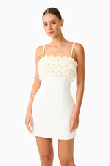 Solenne Party Mini Dress in White with a 3D floral detail close up shot