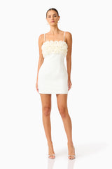 Solenne Party Mini Dress in White with a 3D floral detail posed shot