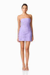 Brunette model wearing the Alya Strapless Midi Dress in purple front shot
