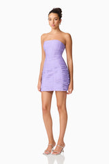 Brunette model wearing the Alya Strapless Midi Dress in purple side shot
