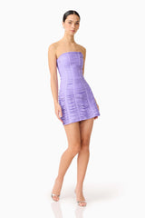 Brunette model wearing the Alya Strapless Mini Dress in Purple posed shot 