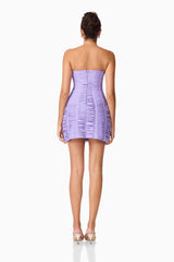 Brunette model wearing the Alya Strapless Midi Dress in purple back shot