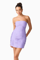 Brunette model wearing the Alya Strapless Midi Dress in purple close up hands behind back shot
