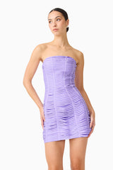 Brunette model wearing the Alya Strapless Mini Dress in Purple close up posed shot 