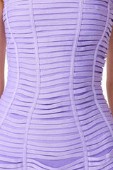 Brunette model wearing the Alya Strapless Mini Dress in Purple detail shot 