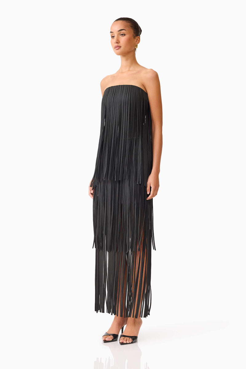 Blonde model wearing the Alya Tiered Maxi Dress in Black side shot