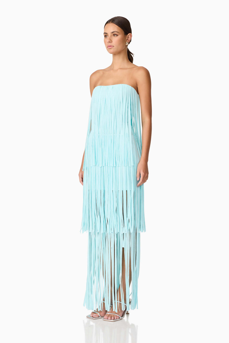 Brunette model wearing the Alya Tiered Maxi Dress in Blue side shot