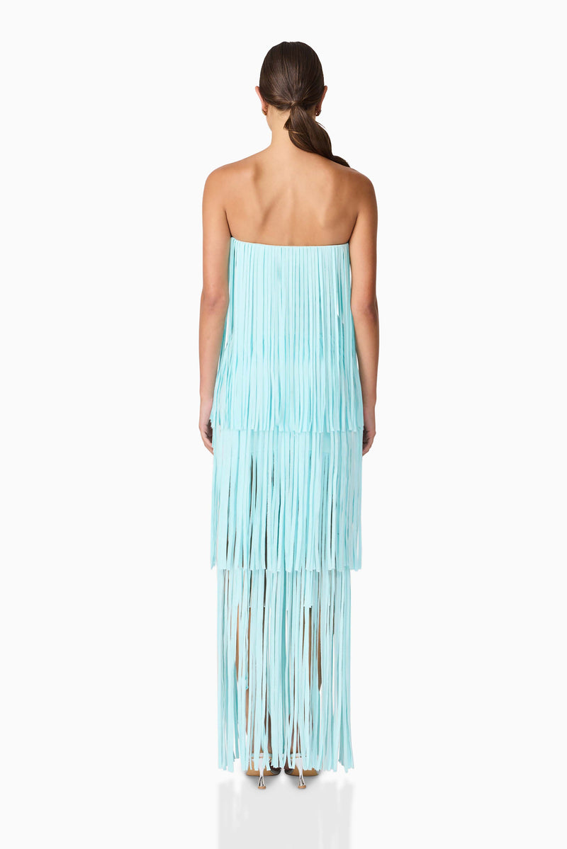 Brunette model wearing the Alya Tiered Maxi Dress in Blue back shot