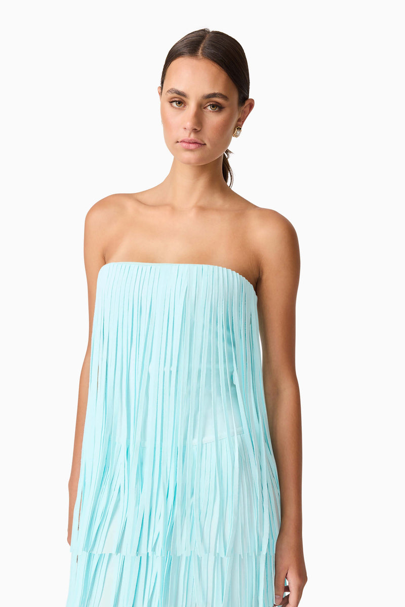 Brunette model wearing the Alya Tiered Maxi Dress in Blue close up shot