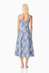 Brunette model wearing the Safia Midi Dress in Blue back shot