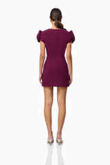 Brunette model wearing Theresa V-Neck Mini Dress in Burgundy back shot
