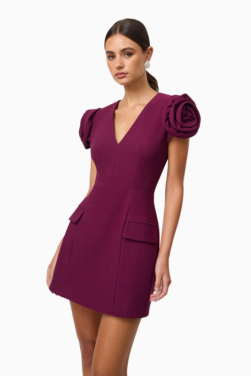 Brunette model wearing Theresa V-Neck Mini Dress in Burgundy close up shot