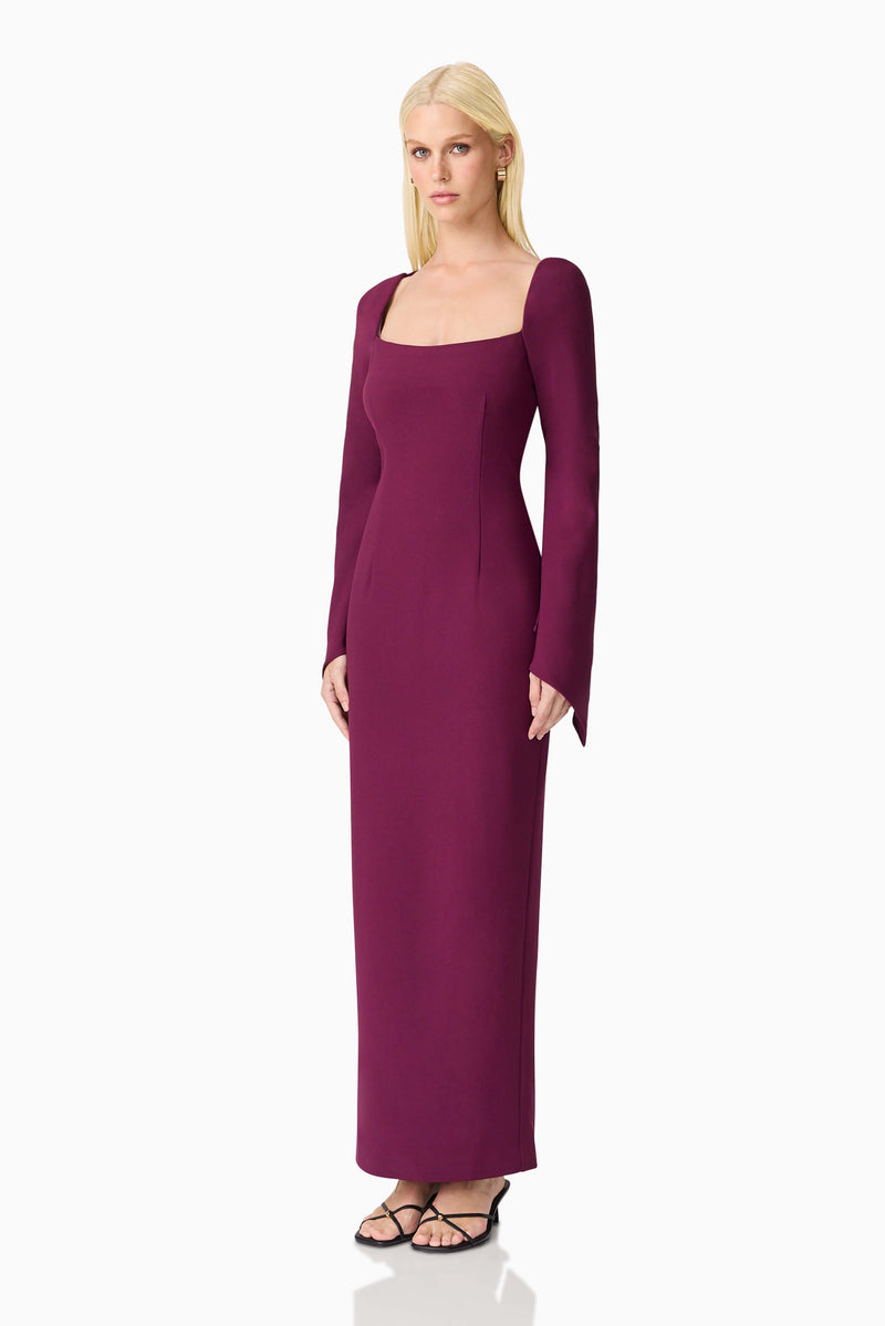 Blonde model wearing the Theresa Long Sleeve Gown in Burgundy side shot