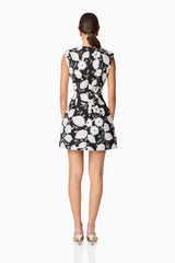 Brunette model wearing the Carol Tulip Mini Dres in Black & White back shot