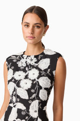 Brunette model wearing the Carol Tulip Mini Dres in Black & White close up shot