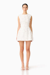 Brunette model wearing Carol Tulip Mini Dress in White front shot