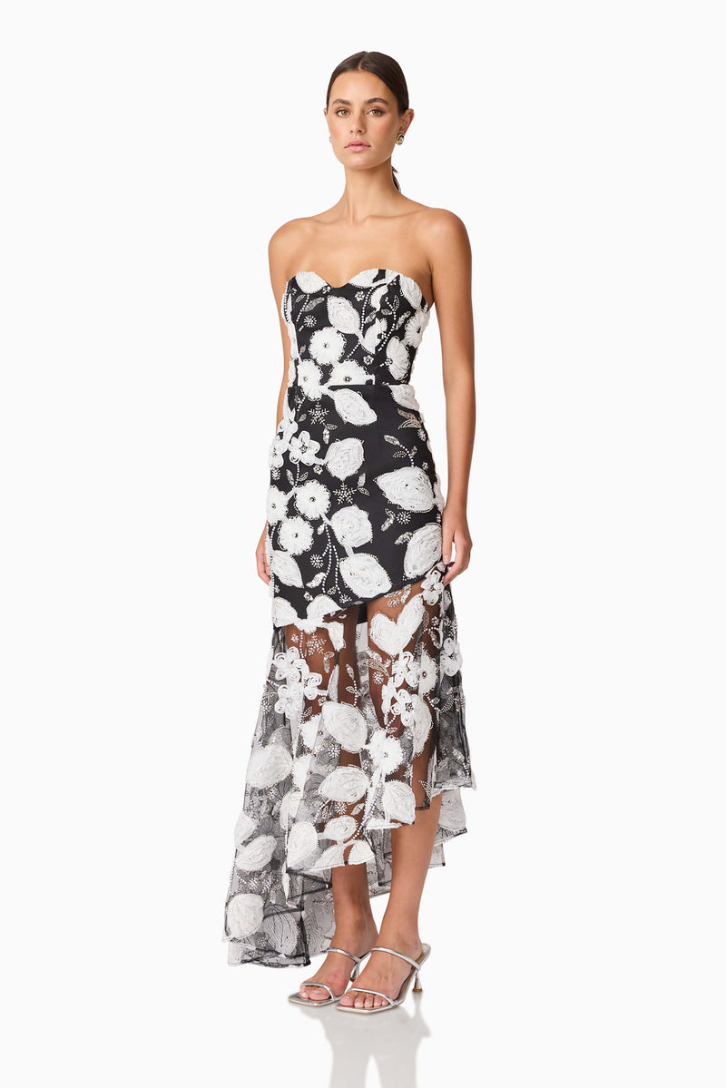 Brunette Model wearing Carol Strapless Gown in Black & White side shot