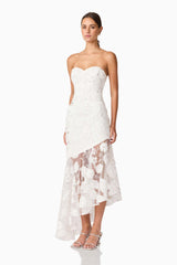 Brunette model wearing Carol Strapless Gown in White side shot