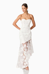 Brunette model wearing Carol Strapless Gown in White looking down shot