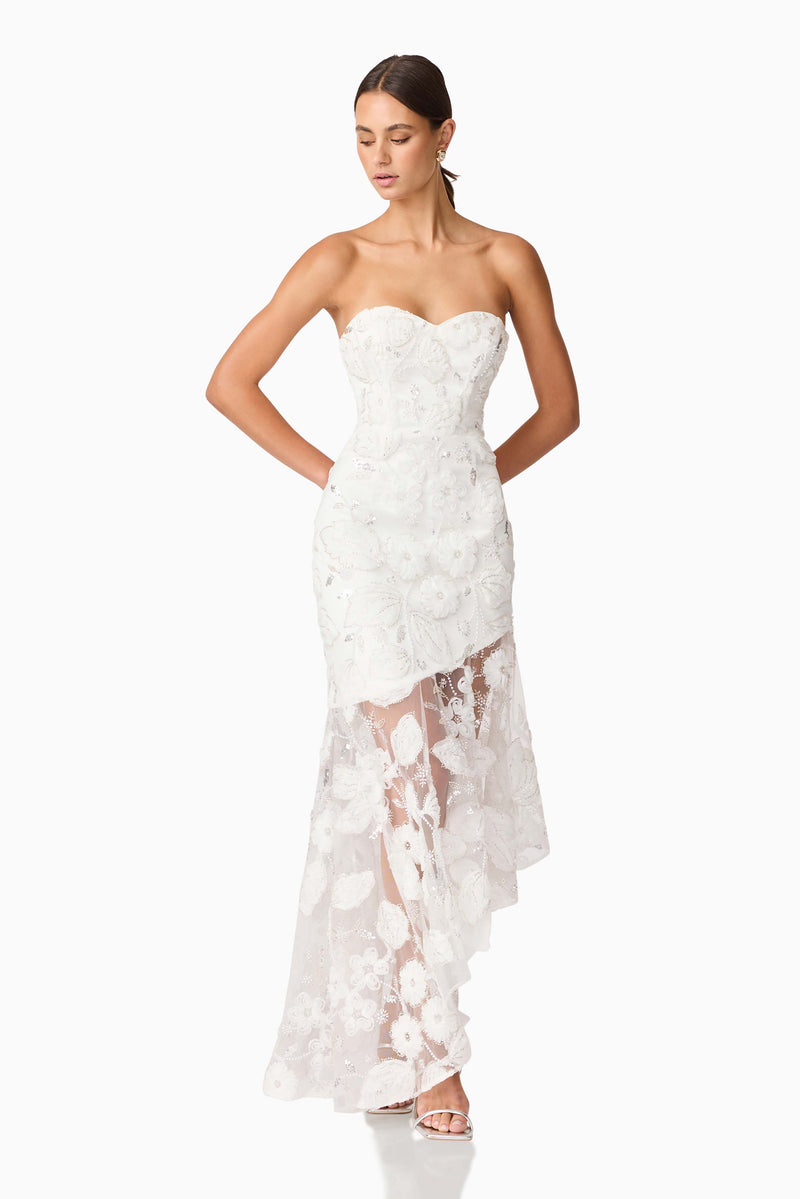 Brunette model wearing Carol Strapless Gown in White looking down shot