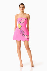 Laurentia Tulip Mini Dress in Fuchsia Pink with strapless neckline & floral embroidered trim posed shot