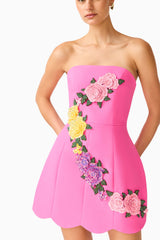 Laurentia Tulip Mini Dress in Fuchsia Pink with strapless neckline & floral embroidered trim close up shot