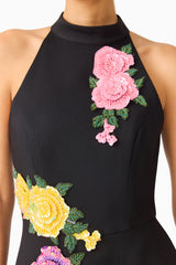 Laurentia Maxi Gown in Fuchsia Black with collared halter neckline and asymmetric peplum detail - detail shot