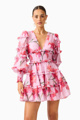 Fleuris Long Sleeve Mini Dress in Pink Floral with ruffle detailing & printed georgette fabrication close up posed shot