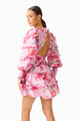 Fleuris Long Sleeve Mini Dress in Pink Floral with ruffle detailing & printed georgette fabrication side posed shot