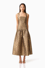Brunette model wearing Elara Drop Waist Dress in Leopard Print front shot