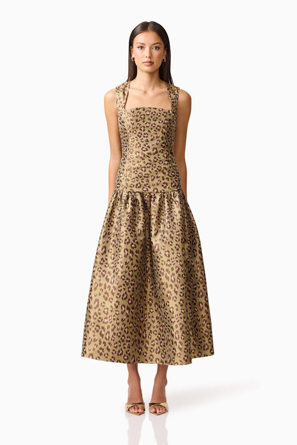 Brunette model wearing Elara Drop Waist Dress in Leopard Print front shot
