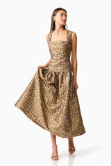 Brunette model wearing Elara Drop Waist Dress in Leopard Print posed shot