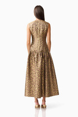 Brunette model wearing Elara Drop Waist Dress in Leopard Print back shot