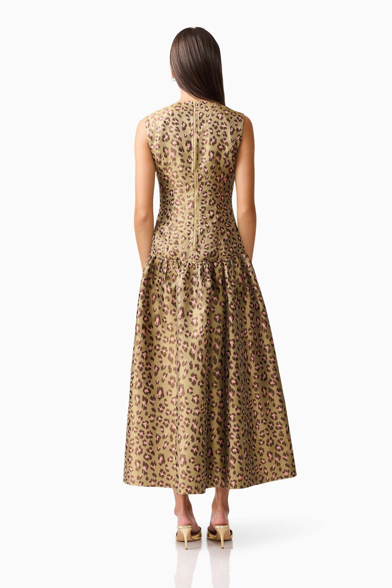 Brunette model wearing Elara Drop Waist Dress in Leopard Print back shot