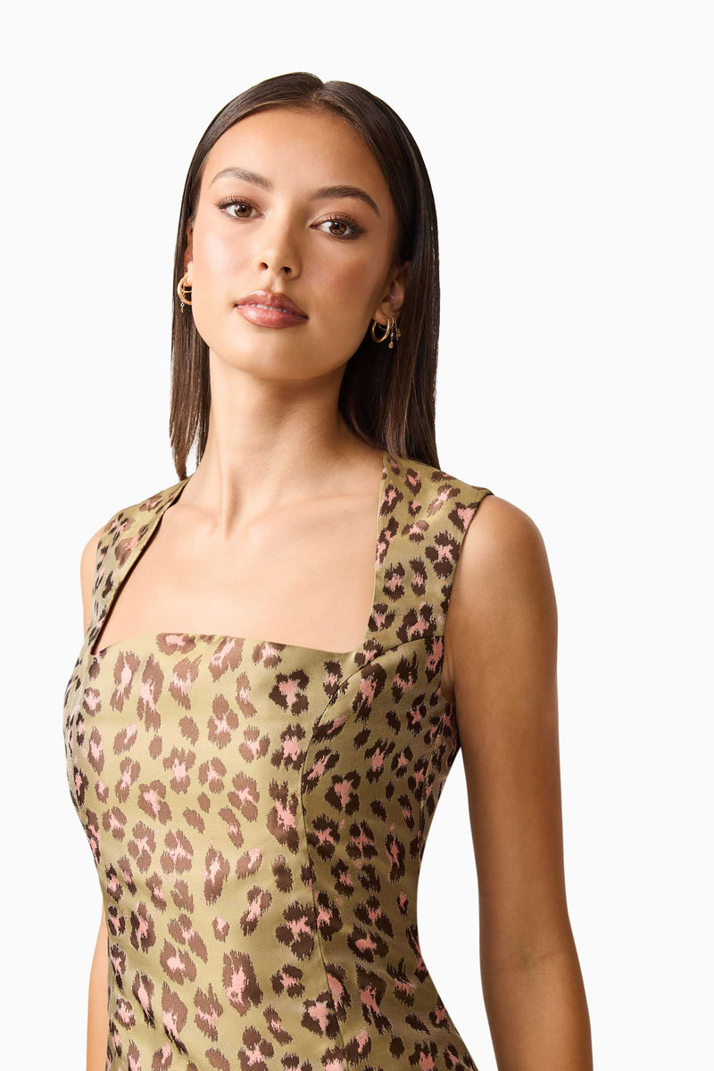 Brunette model wearing Elara Drop Waist Dress in Leopard Print close up shot