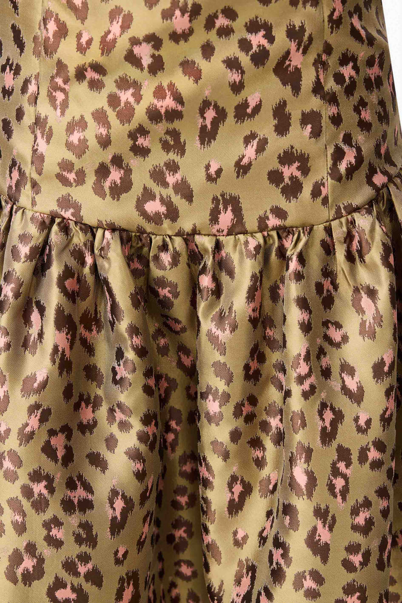 Brunette model wearing Elara Drop Waist Dress in Leopard Print detail shot