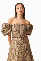 Brunette model wearing the Elara Off The Shoulder Mini Dress in Leopard Print close up shot
