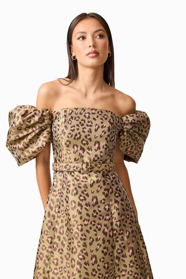 Brunette model wearing the Elara Off The Shoulder Mini Dress in Leopard Print close up shot