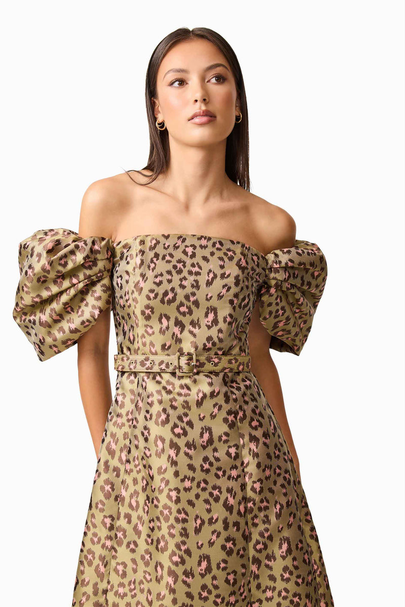 Brunette model wearing the Elara Off The Shoulder Mini Dress in Leopard Print close up shot