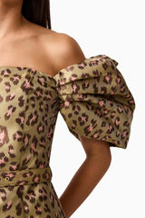 Brunette model wearing the Elara Off The Shoulder Mini Dress in Leopard Print detail shot