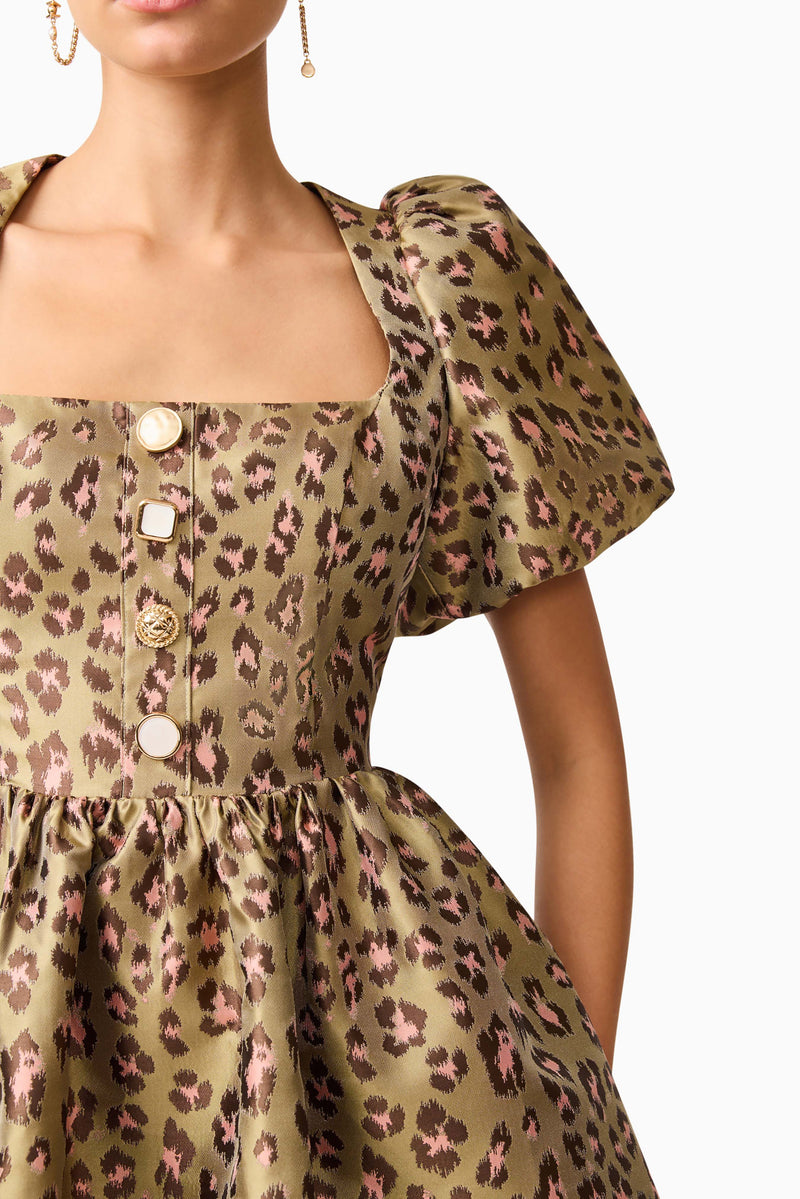 Brunette model wearing the Elara Romper Mini Dress in Leopard Print detail shot