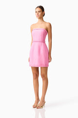 Brunette model wearing Coralene Puff Sleeve Midi Dress in Pink side shot