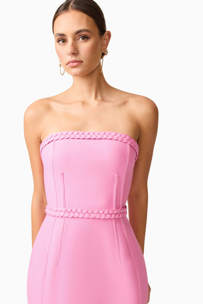 Brunette model wearing Coralene Puff Sleeve Midi Dress in Pink hand close up shot