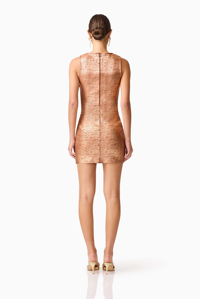 Brunette model wearing the Rhian Fitted Mini Dress in Orange Back Shot