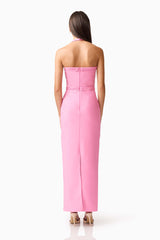 Brunette model wearing Coralene Halter Gown in Pink back shot