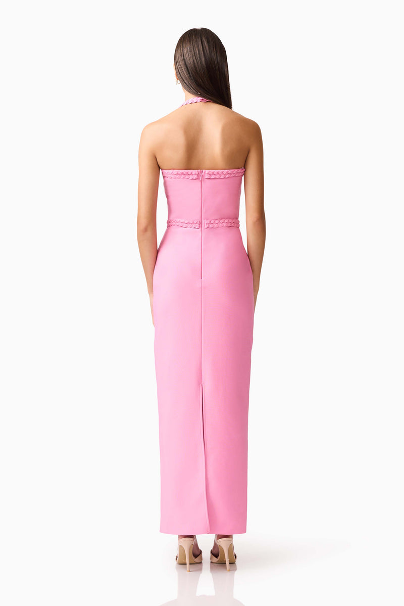 Brunette model wearing Coralene Halter Gown in Pink back shot